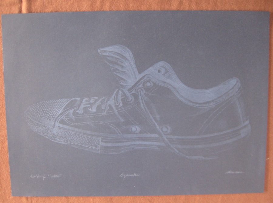 Big sneeker on black paper